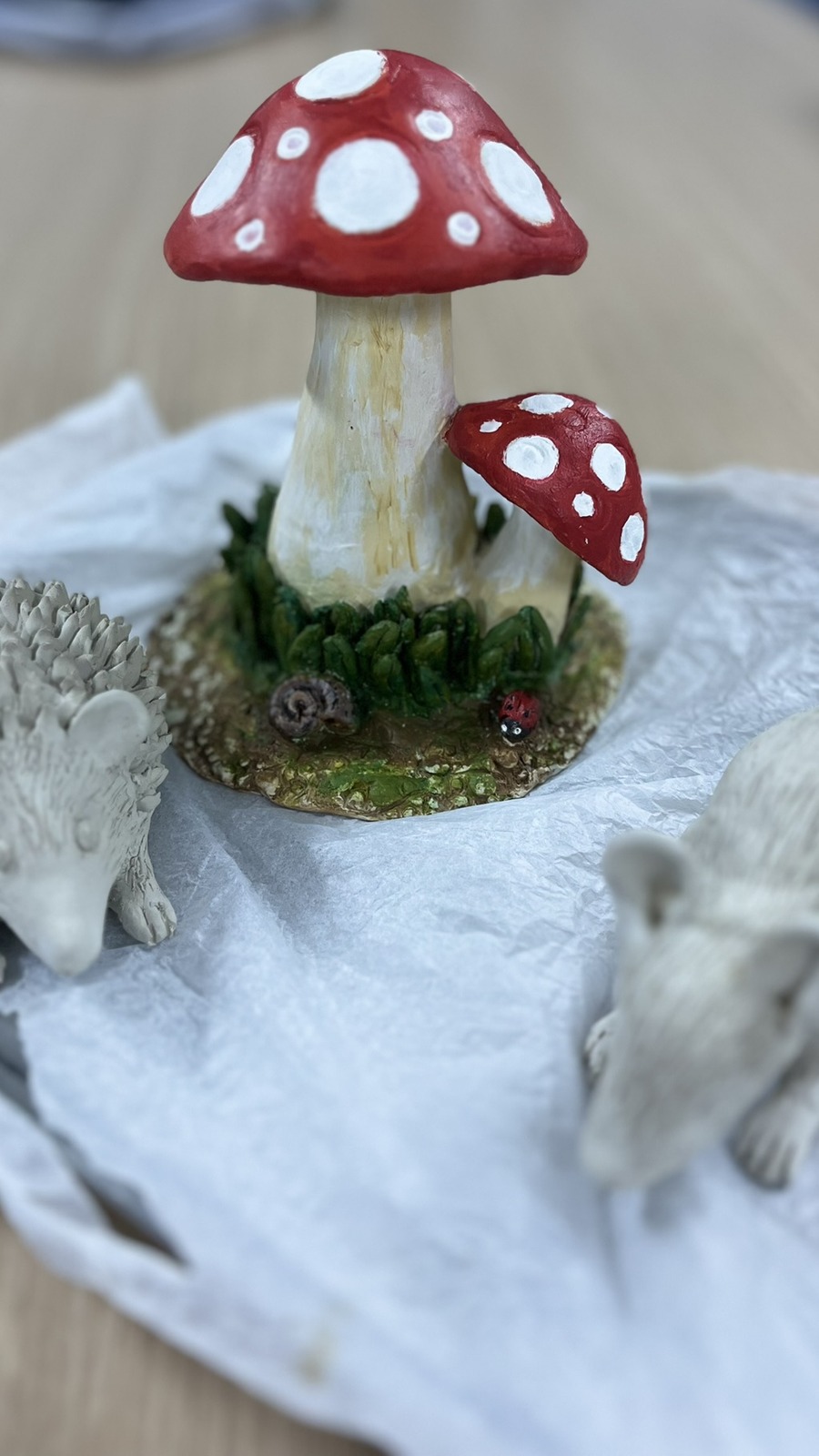 Student 3D ceramic sculptures — hedgehog, mushroom and mouse